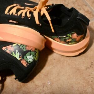 Brooks Black and Orange Sneakers with Floral Accents